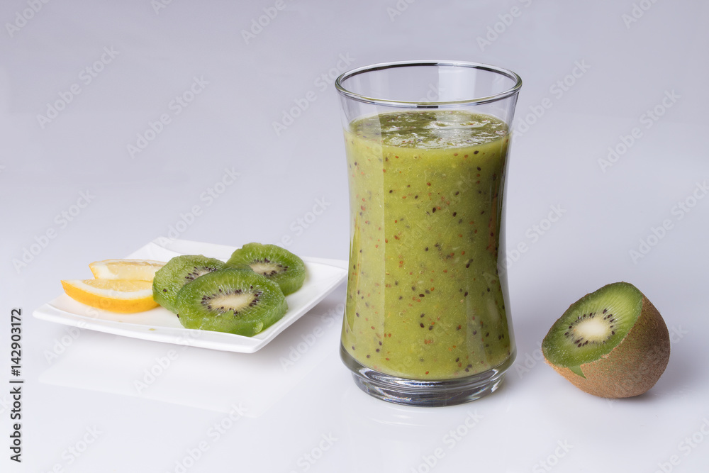 glass of smoothie on a white table glass of smoothie on a white table