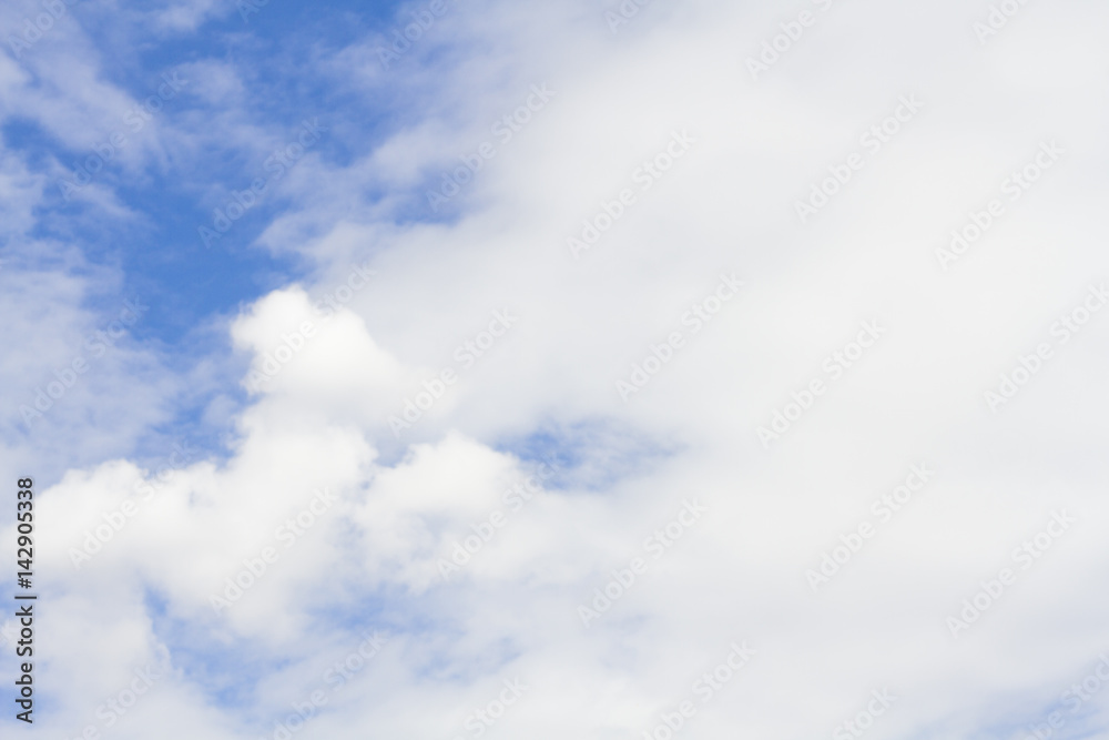 Obraz premium white fluffy clouds in the blue sky with sunset.