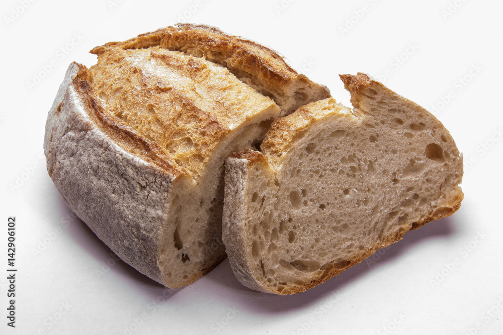 Rustic bread on an white. Country house style. Authentically. Rustic bread on an white. Country house style. Authentically.