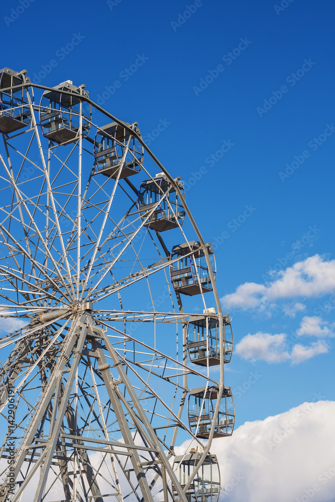 Ferris wheel. Open cabins of the Ferris wheel.