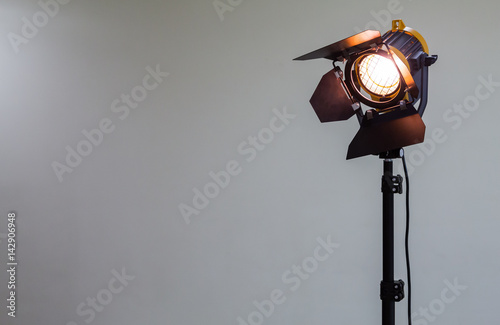 Spotlight with halogen bulb and Fresnel lens. Lighting equipment for Studio photography or videography.