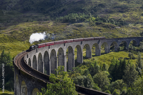 Jacobite steam train on Glenfinnan Viaduct approaching