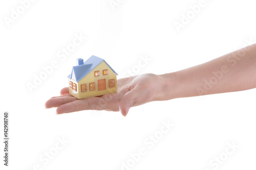 Hand holding house