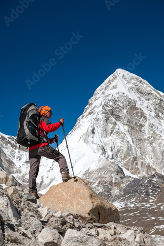 Trekker approaching PumoRi mountain in Khumbu valley on a way to Everest Base camp
