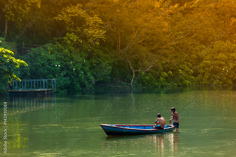 Fototapeta premium November 22, 2013, boys are bathing in Phewa lake in Pokhara