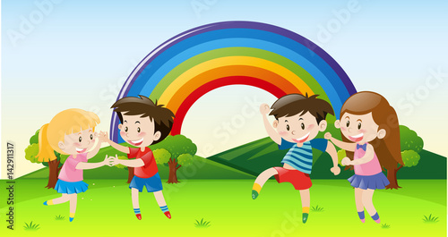 Happy children dancing in park