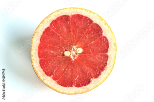 Closeup of a grapefruit half on a white background