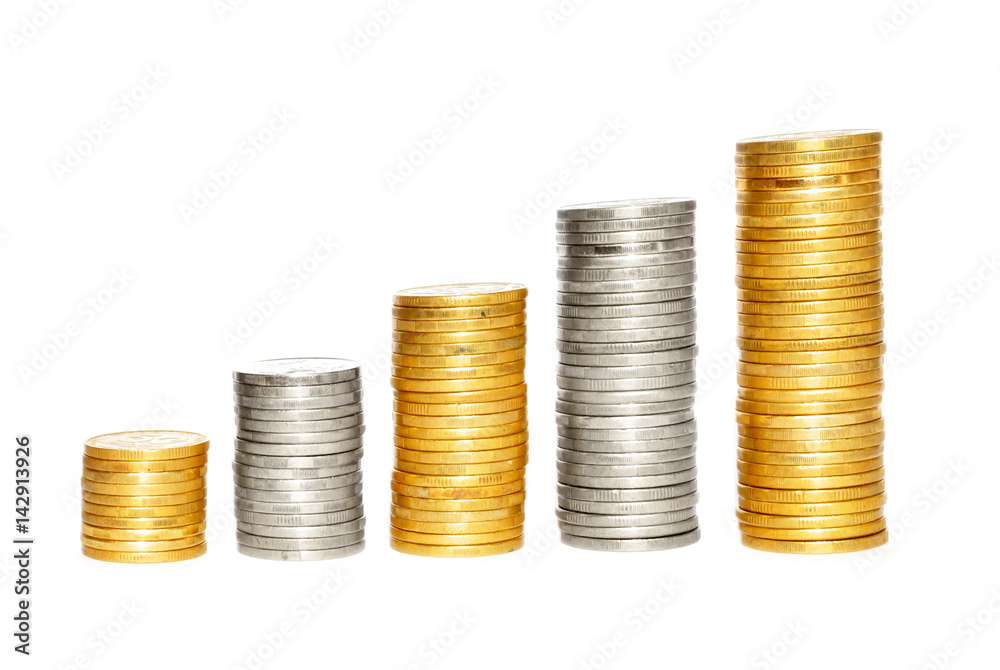 Savings, increasing columns of gold and silvercoins over white background Savings, increasing columns of gold and silvercoins over white background