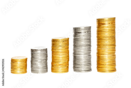 Savings, increasing columns of gold and silvercoins over white background photo