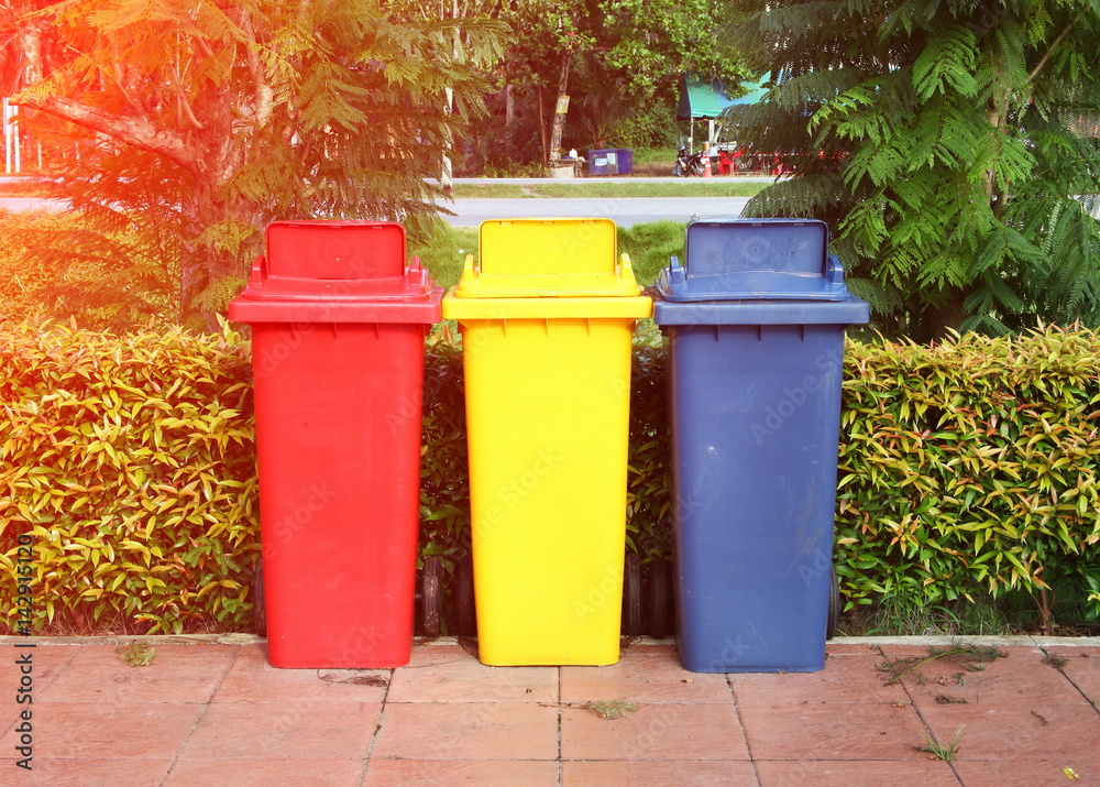 A group of old and dirty abandoned garbage bins put on the floor among outdoor and daytime natural light atmosphere. A group of old and dirty abandoned garbage bins put on the floor among outdoor and daytime natural light atmosphere.