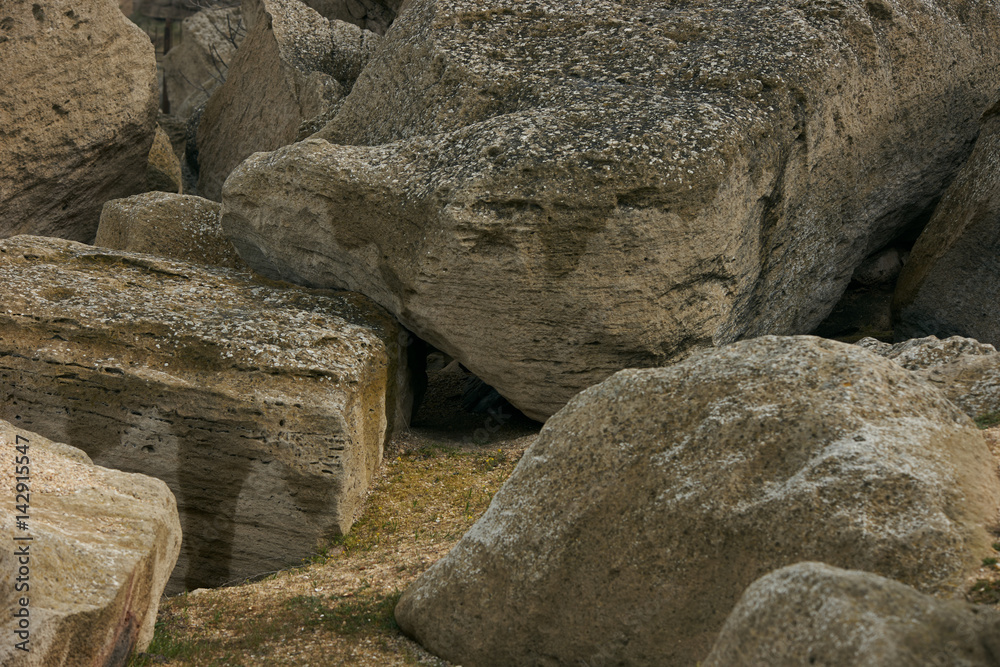 Close-up of Beautiful Wet rocky cliffs on seaside shore. Nature and adventure concept. Close-up of Beautiful Wet rocky cliffs on seaside shore. Nature and adventure concept.