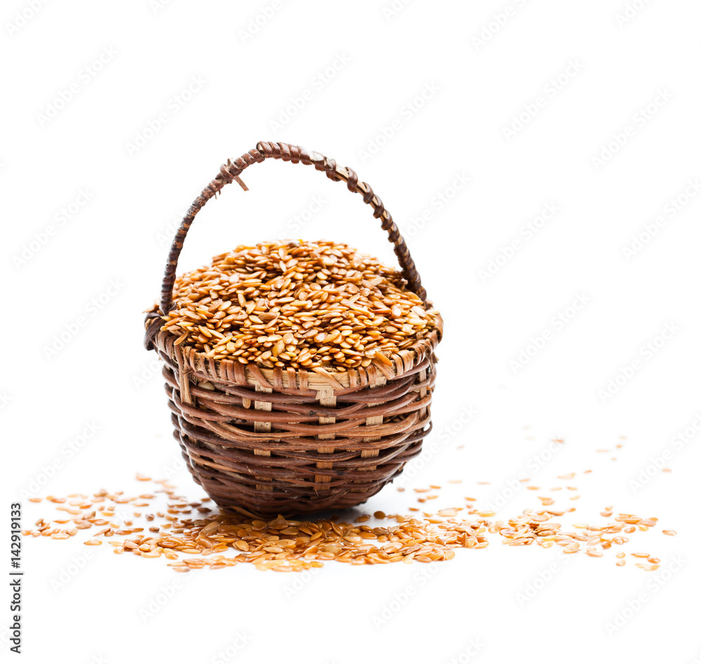 Flax seeds in small basket on white background Flax seeds in small basket on white background