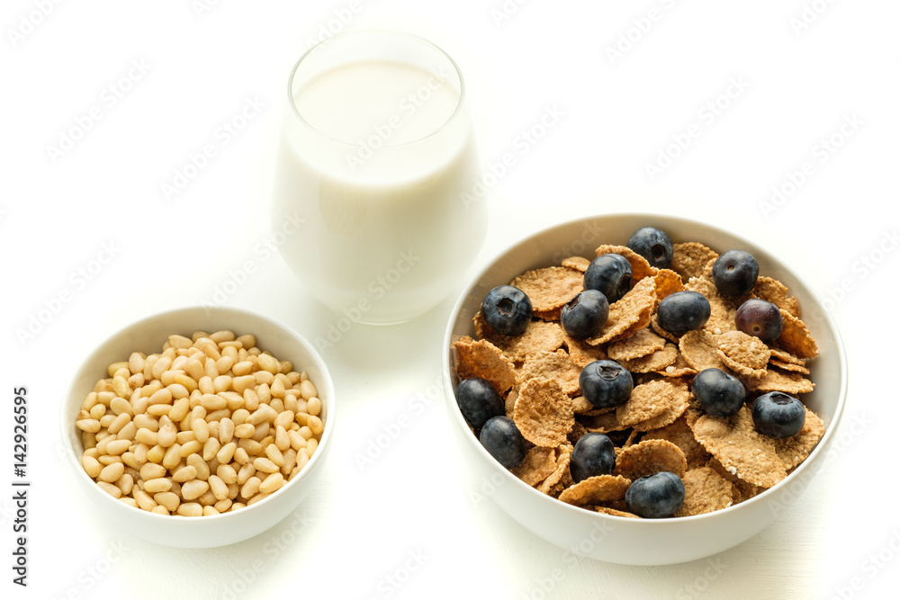 Healthy food. Multi grain flakes with blueberry and milk for breakfast. Healthy food. Multi grain flakes with blueberry and milk for breakfast.