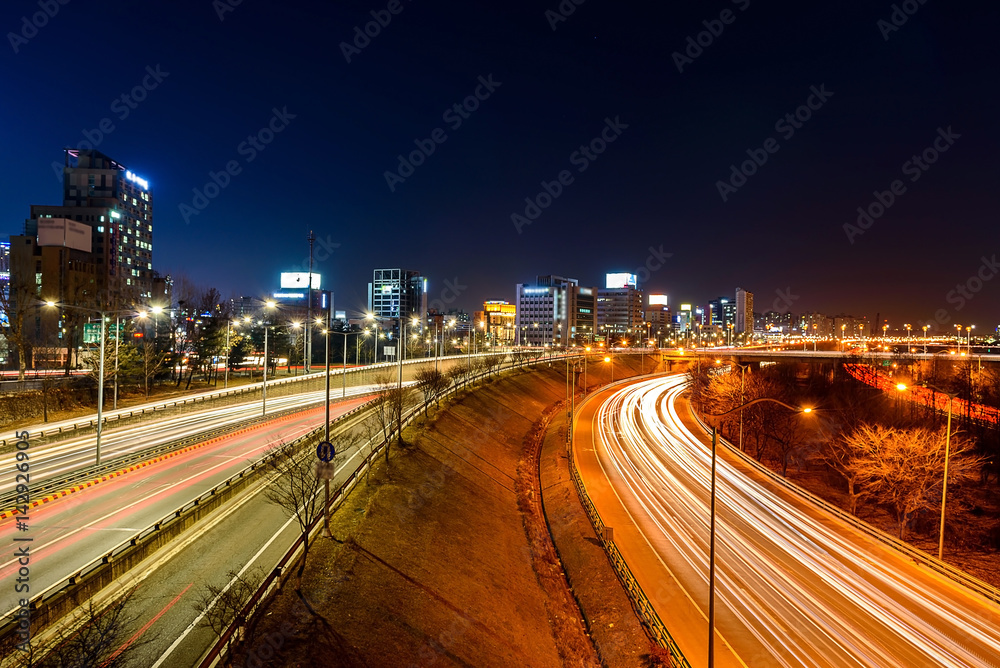 Fototapeta premium Light trails on a highway at night