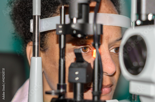 Young african woman at an optician