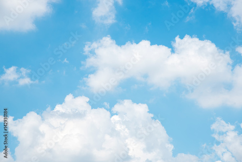 Beautiful white fluffy clouds in the blue sky. Fresh natural in day time. Use for nature background.