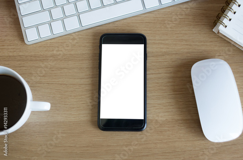 Office desk table with blank screen smart phone