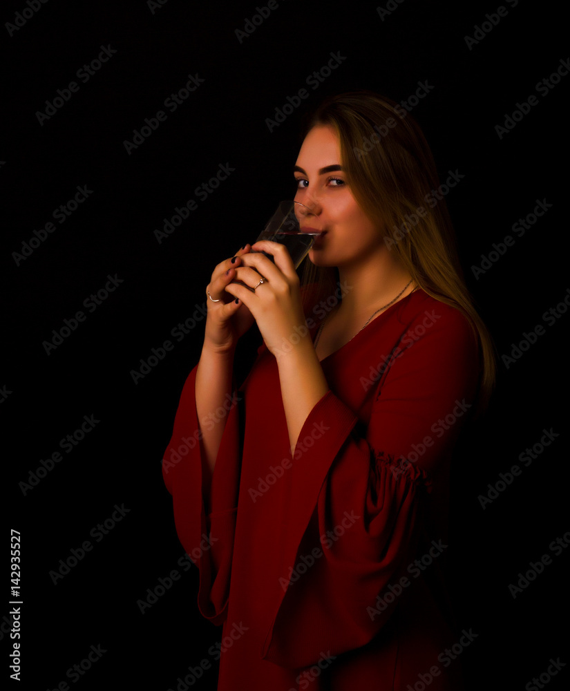 Young pretty girl drinks water Glass of mineral water Young pretty girl drinks water Glass of mineral water