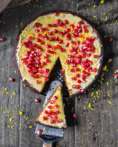 Overhead view of chai pumpkin cake placed on a wooden surface