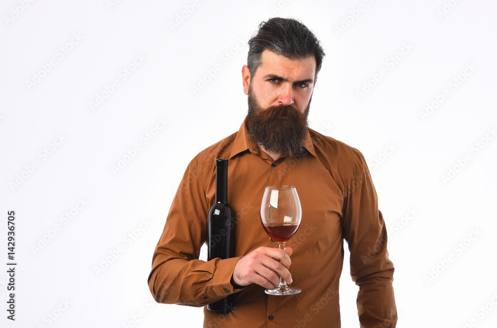bearded man hipster with wine bottle, glass in brown shirt bearded man hipster with wine bottle, glass in brown shirt