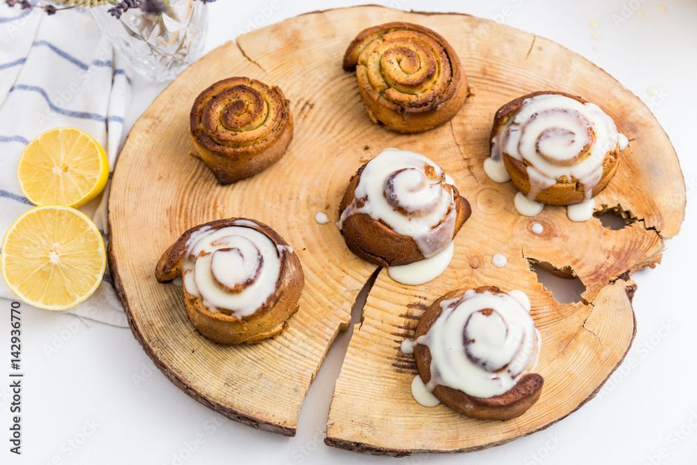 Freshly Cinnabon on wooden disk Freshly Cinnabon on wooden disk
