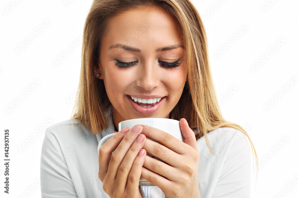 Adult woman drinking cup of tea coffee isolated over white Adult woman drinking cup of tea coffee isolated over white