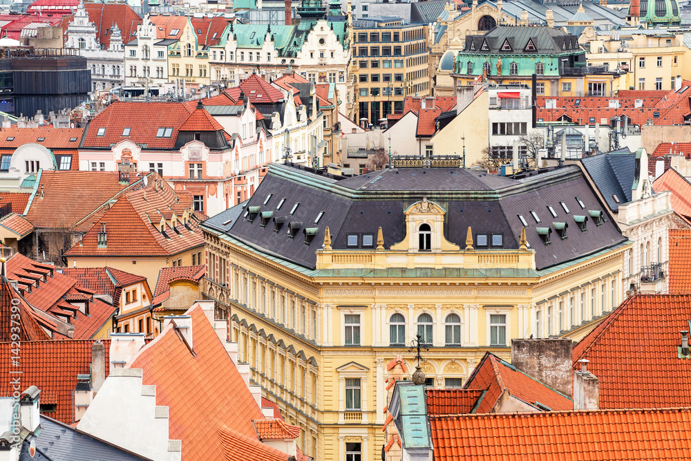 Aerial cityscape view of houses and orange roofs typical of Prague