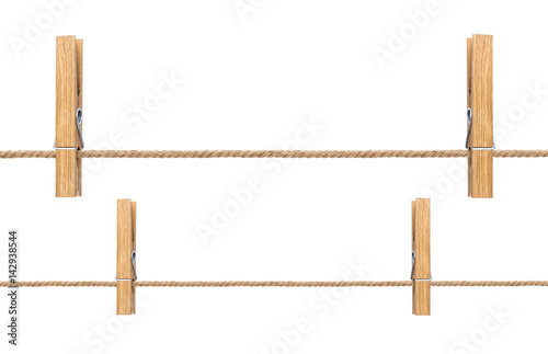 Isolated clothespins. Wooden clothespins on rope isolated on white background with clipping path