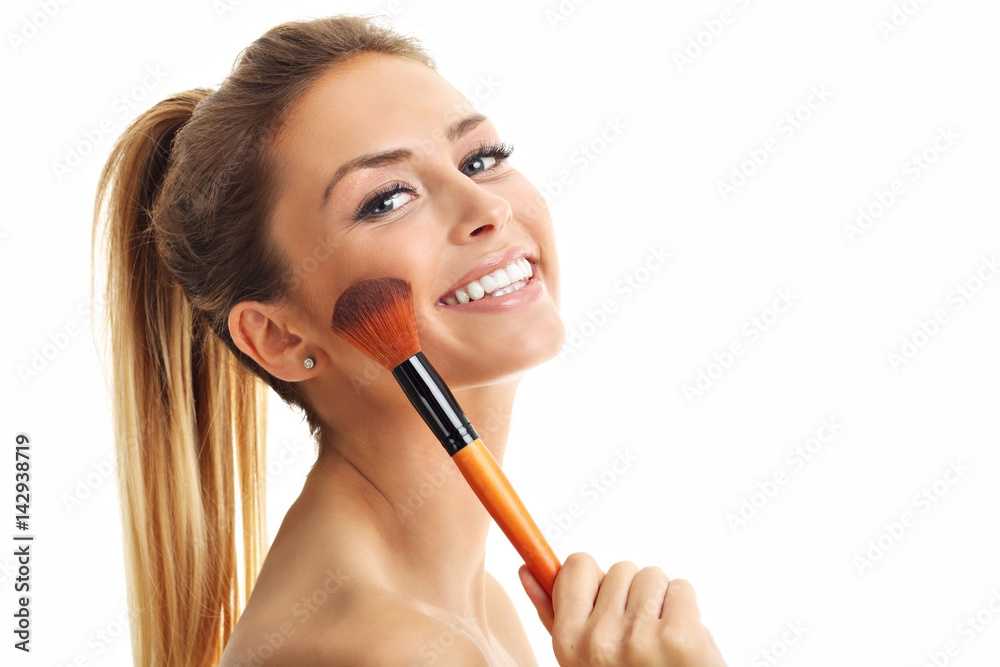 Beauty portrait of adult woman with the makeup brush isolated on white Beauty portrait of adult woman with the makeup brush isolated on white