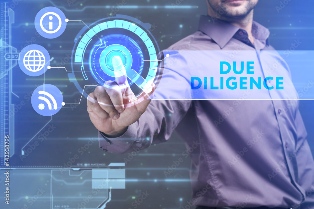 Business, Technology, Internet and network concept. Young businessman working on a virtual screen of the future and sees the inscription: Due diligence Business, Technology, Internet and network concept. Young businessman working on a virtual screen of the future and sees the inscription: Due diligence