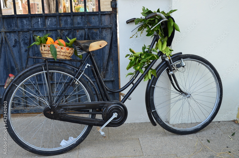 rural bicycle with fruits in wicker basket