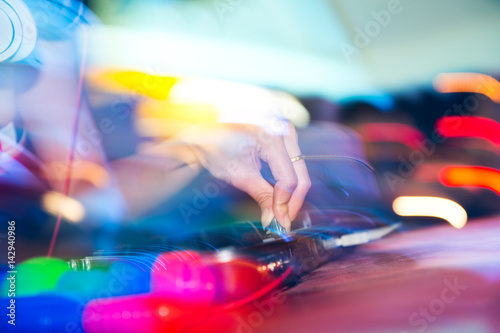 Dj mixing in nightclub at party.
