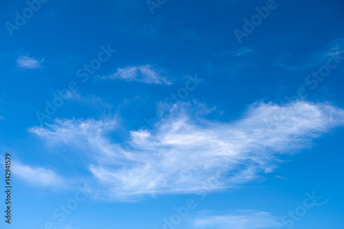 White clouds in the blue sky.