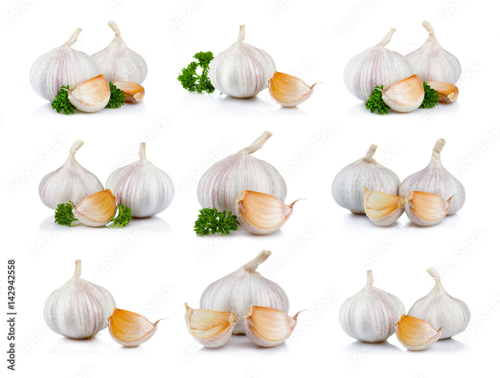 Set of ripe garlic vegatables with cloves isolated on white Set of ripe garlic vegatables with cloves isolated on white