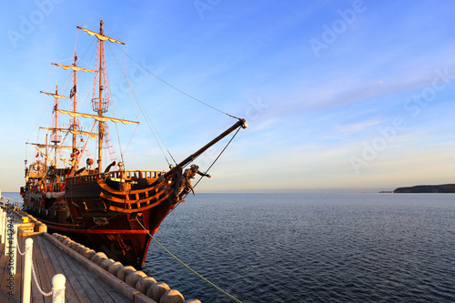 Old wooden ship at pier