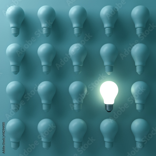 Billede på lærred One glowing light bulb standing out from the unlit incandescent bulbs on green background with reflection , individuality and different creative business bright idea concepts