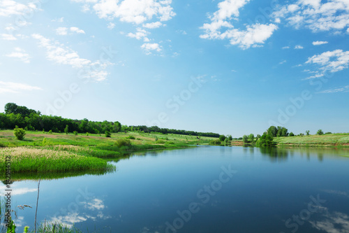 Landscape with pond and hills