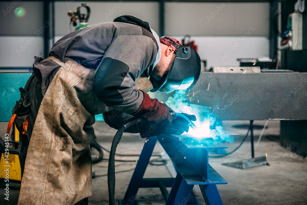 Fototapeta premium Industrial Welder With Torch