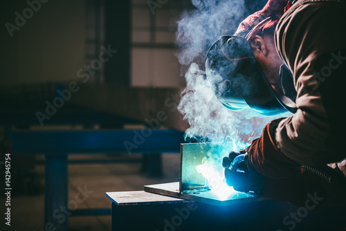 фотографія Industrial Welder With Torch