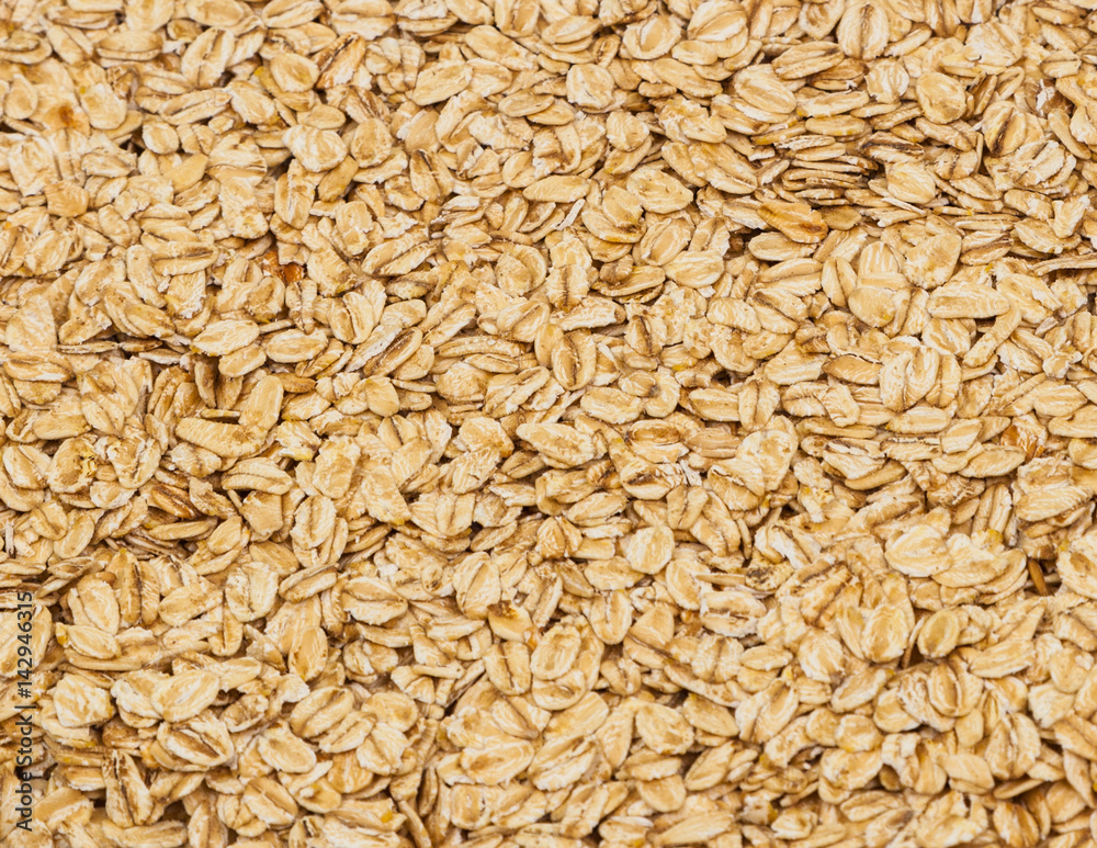 Surface coated with oatmeal flakes as a backdrop texture composition