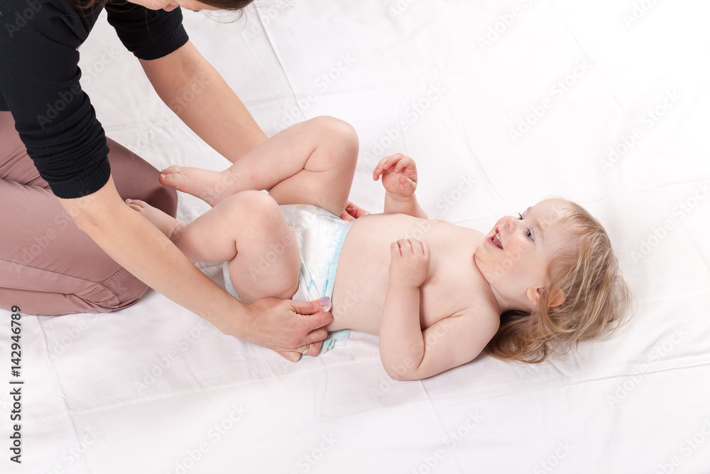 mom play change baby son  diaper
