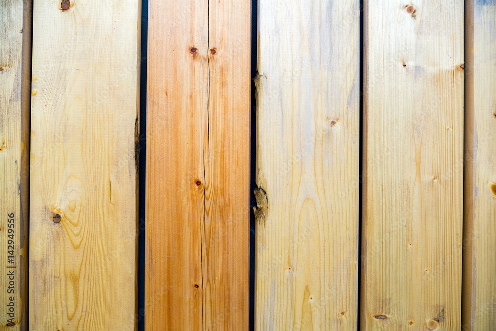 The textured surface of the wooden planks for construction and garden improvement The textured surface of the wooden planks for construction and garden improvement