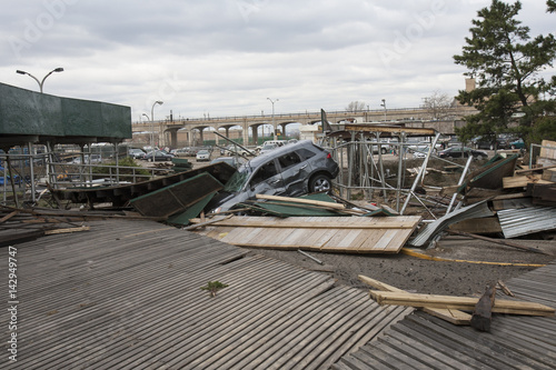 Obraz na płótnie NEW YORK - November 1: Large section of the iconic boardwalk was washed away during Hurricane Sandy in Far Rockaway area October 29, 2012 in New York City, NY w salonie