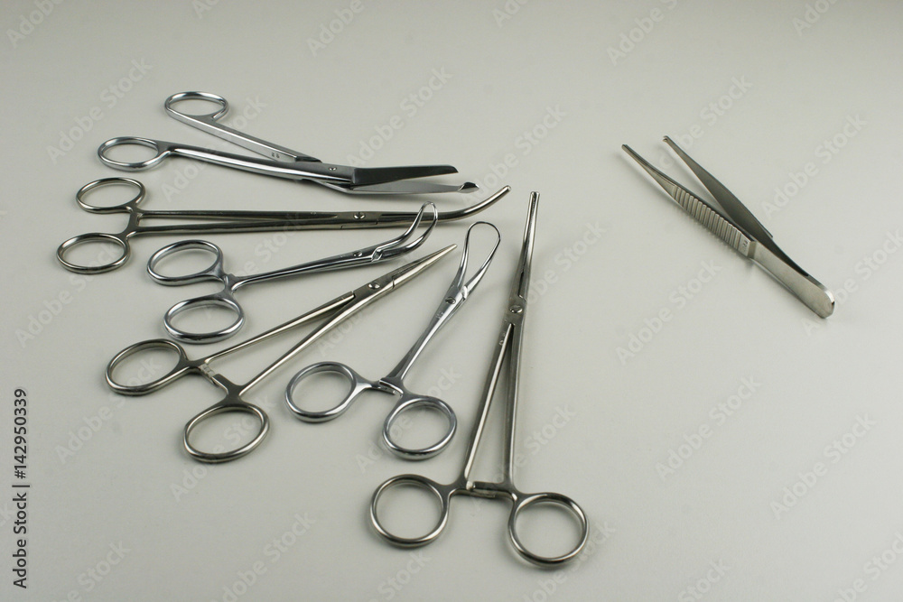 Surgical Instruments on grey background. Surgical Instruments on grey background.