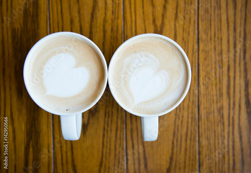 two cups of coffee cappuccino with heart shape