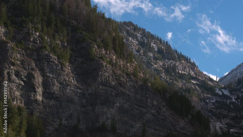 Aerial view of a beautiful mountainside and snowy cliffs in Utah. Aerial view of a beautiful mountainside and snowy cliffs in Utah.