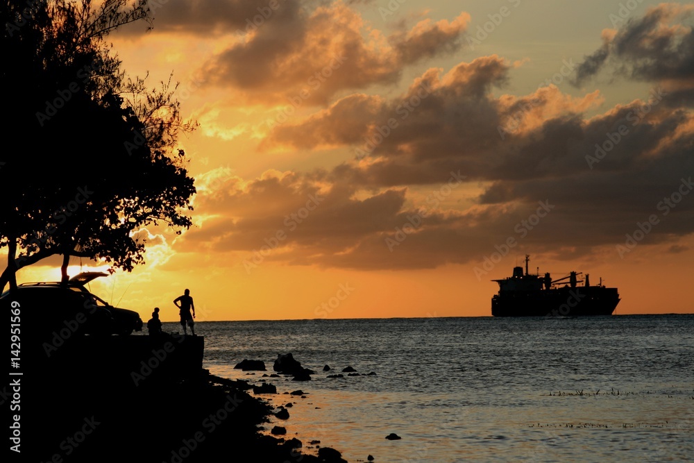 Sunset at the Fishing Base Lovely cloud formations backdrop the setting sun at the Fishing Base in Garapan, Saipan.
