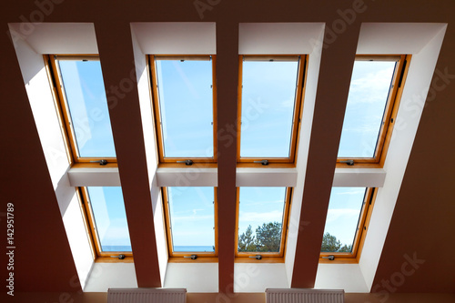 Construction of eight attic windows. Large  luxury skylights. Roof windows