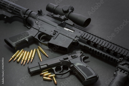 Assault rifle with handgun and ammunition. Military weapon photo