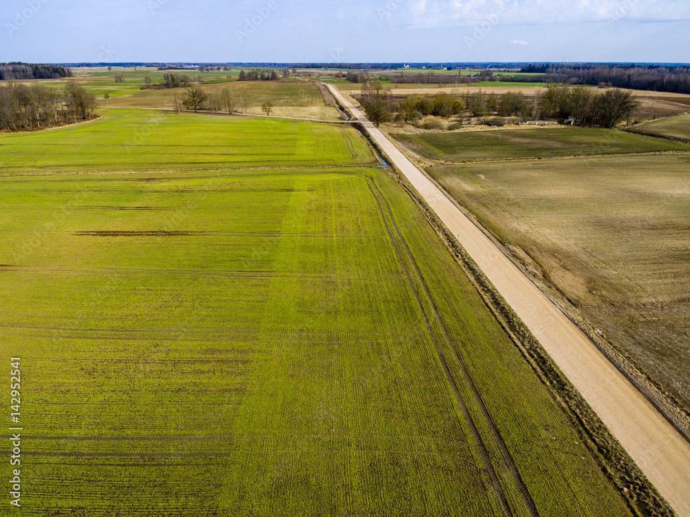 drone image. aerial view of rural area with freshly green fields drone image. aerial view of rural area with freshly green fields